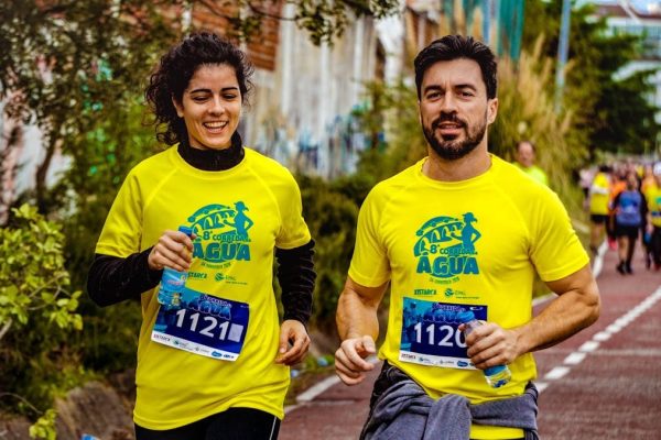 Two athletes participating in a marathon, showing determination and joy.